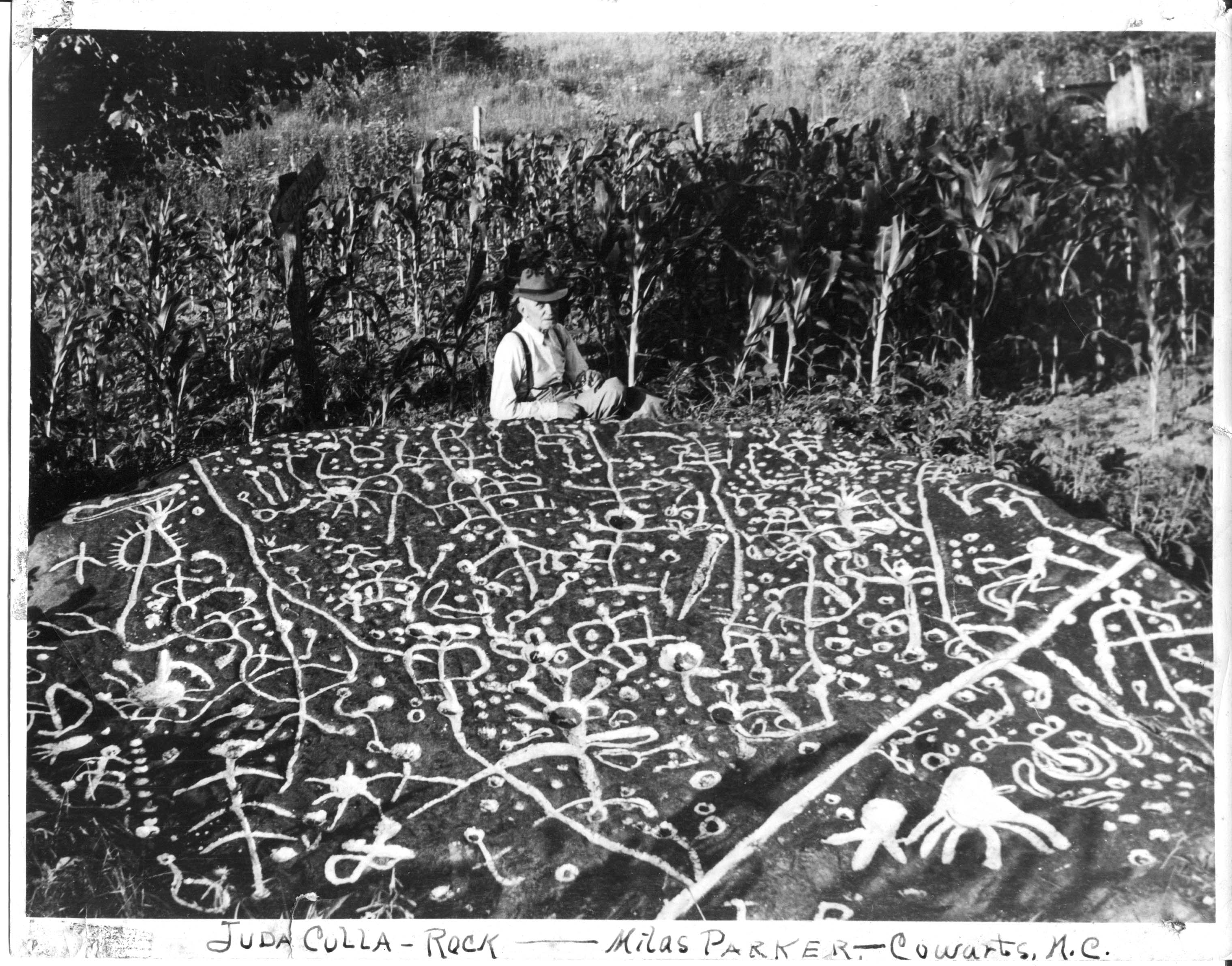 For this 1930s photo, the cryptic markings were filled with chalk. Since this valuable picture was made, the rock has continued to erode, making serious study increasingly difficult. [photo courtesy Jerry Parker]